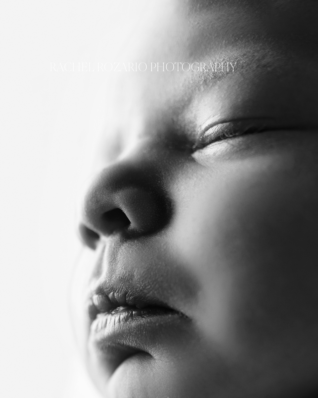close up of sleeping newborn baby's lips an dnose in black and white by Newborn Photographer Wirral 
