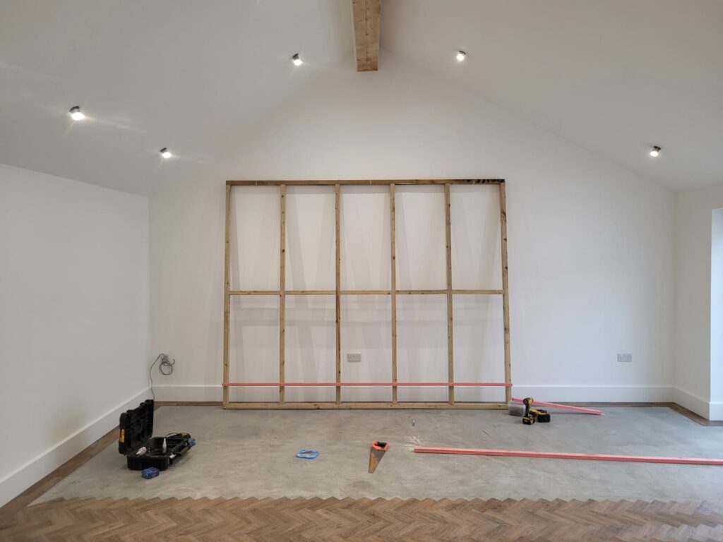 Led light wall build in progress in Wirral's timeless, white photography studio.