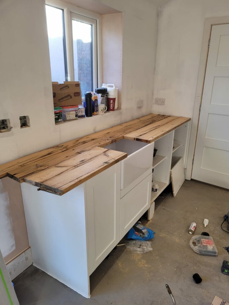 The build of a kitchen area in Wirral's timeless, white photography studio - Rachel Rozario Photography.