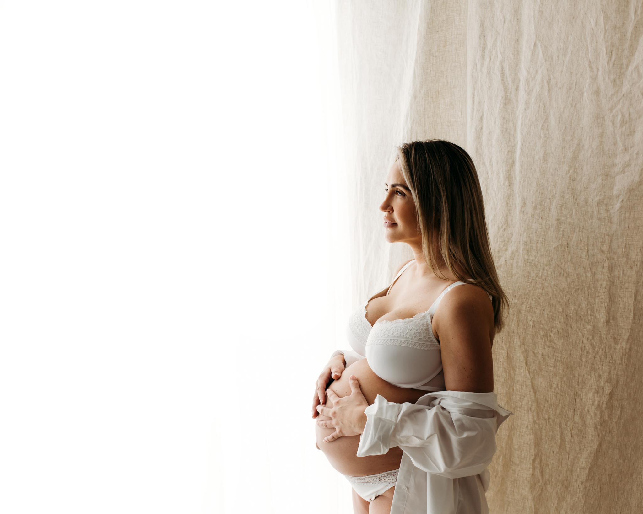 Beautiful pregnant woman at maternity photoshoot by Wirral photographer.
